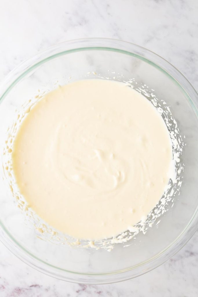 Mini cheesecake batter in a glass bowl.